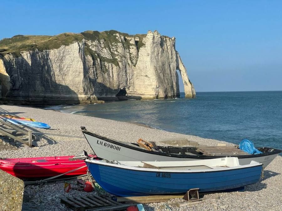 Beached boats under the chalk cliffs